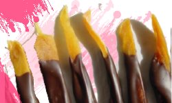 Slices of soft dried mango dipped in dark chocolate